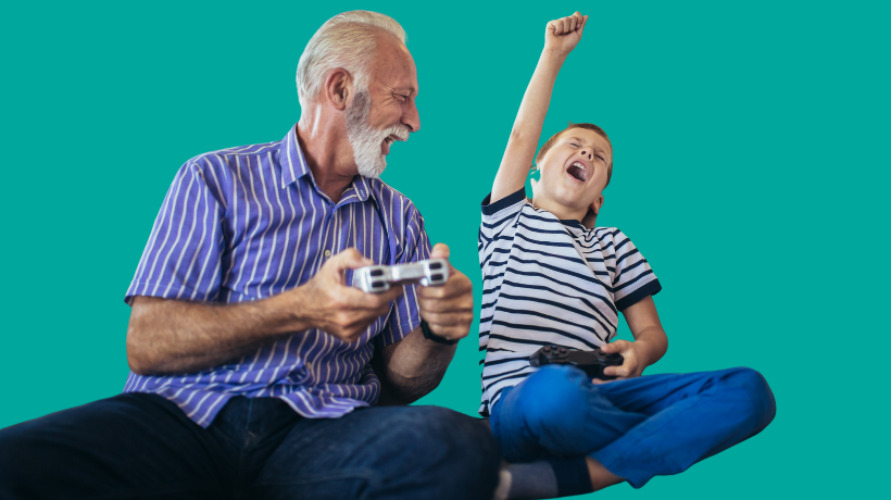 Grandfather and grandson playing a video game