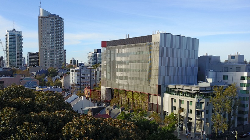 A city-scape with the Garvan Institute of Medical Research in the foreground.