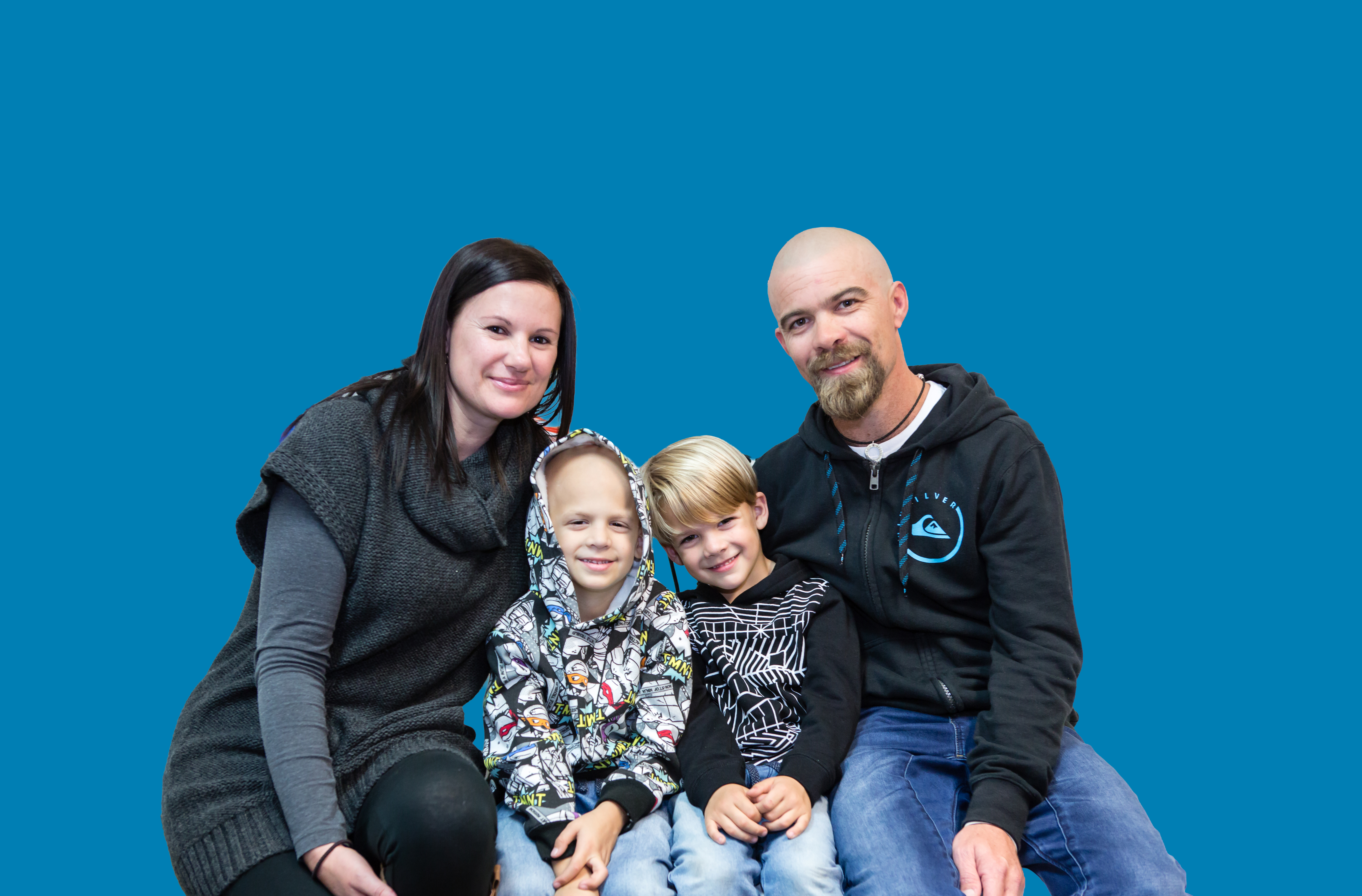 Declan with his little brother Brodie and his mum and dad.