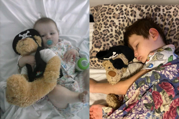 Child with pirate bear that lifts spirits and raises money to assist children survive cancer