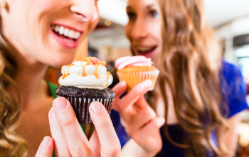 Register your cupcake event - fantastic cupcakes being eaten by two women