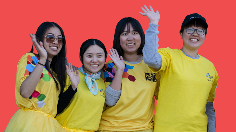 Four smiling young people are waving while wearing TKCP gold tee-shirts and gold tutus.