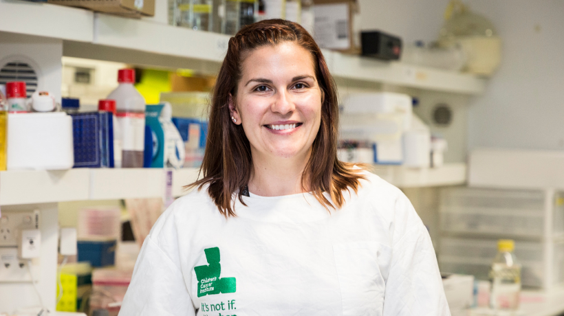 Dr Dannielle Upton smiles while working in her lab.